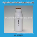 White ceramic bottle with cork